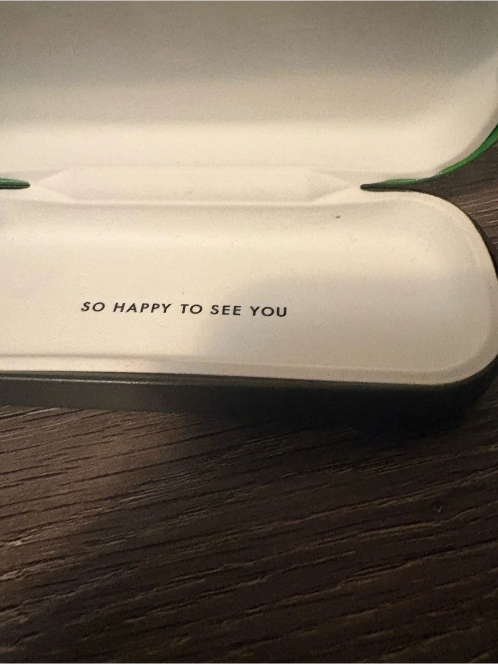 kate spade Green glass case. Has flaw on front.